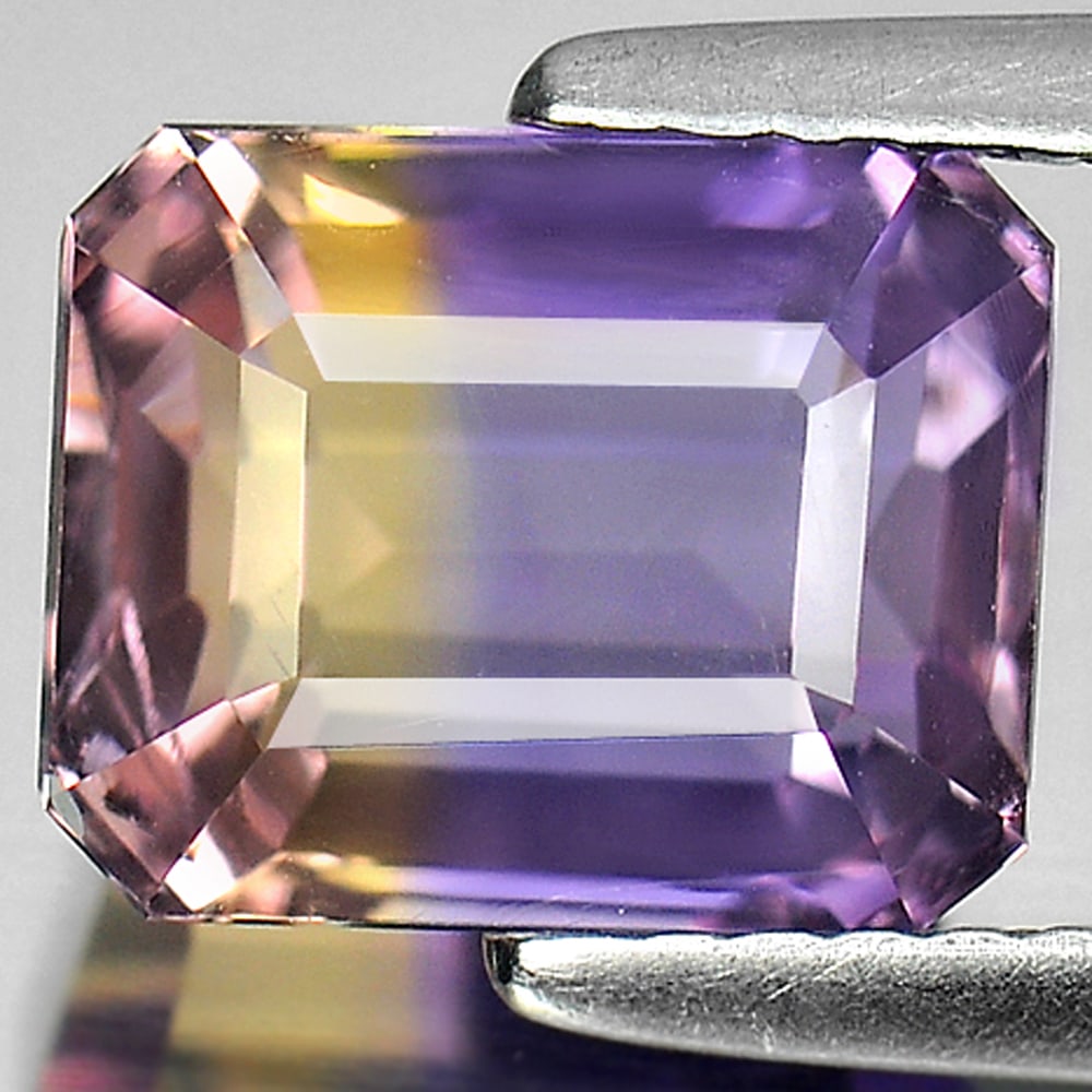 Natural Bi Color Ametrine Gemstones 2.91 Ct. Octagon Shape 8.8 x 7.1 Mm.: Product ID: 800405141 Product Name: Natural Ametrine Weight: 2.91 CT. Size: 8.8 x 7.1 x 6 MM. Shape: Octagon Color: Bi Color Clarity:VVS Luster: Good Gems Origin: Bolivia Treatment: Unheated Crystal S