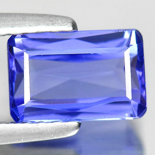 Natural Blue Tanzanite Gemstones 1.24 Ct. VVS Octagon Shape 7.7 x 5 Mm.: Product ID: 807009122 Product Name: Natural Tanzanite Weight: 1.24 CT. Size: 7.7 x 5 x 3 MM. Shape: Octagon Color: Violetish Blue Clarity:VVS Luster: Good Gems Origin: Tanzania Treatment: Heated Cryst