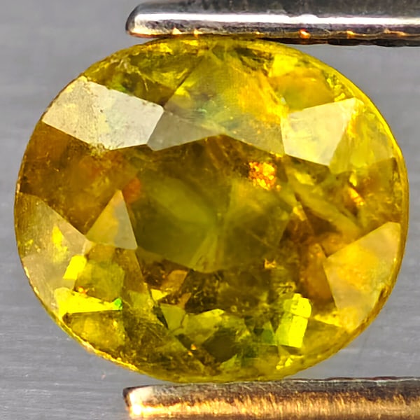 Natural Multi Color Titanium Rainbow Spark Sphene Gemstones 1.80 Ct. Oval Shape 7.5 x 6.7 Mm.: Product ID: 806509077 Product Name: Natural Sphene Weight: 1.80 CT. Size: 7.5 x 6.7 x 4.5 MM. Shape: Oval Color: Multi-Color Clarity:SI1 Luster: Good Gems Origin: Madagascar Treatment: Unheated Crysta