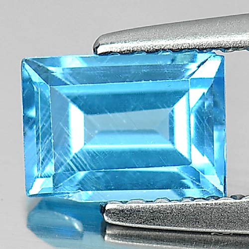 Natural Swiss Blue Topaz Gemstones 1.14 Ct. Baguette Shape 6.8 x 5 Mm.: Product ID: 807132433 Product Name: Natural Blue Topaz Weight: 1.14 CT. Size: 6.8 x 5 x 3.5 MM. Shape: Baguette Color: Swiss Blue Clarity:SI Luster: Good Gems Origin: Brazil Treatment: Treated Crystal