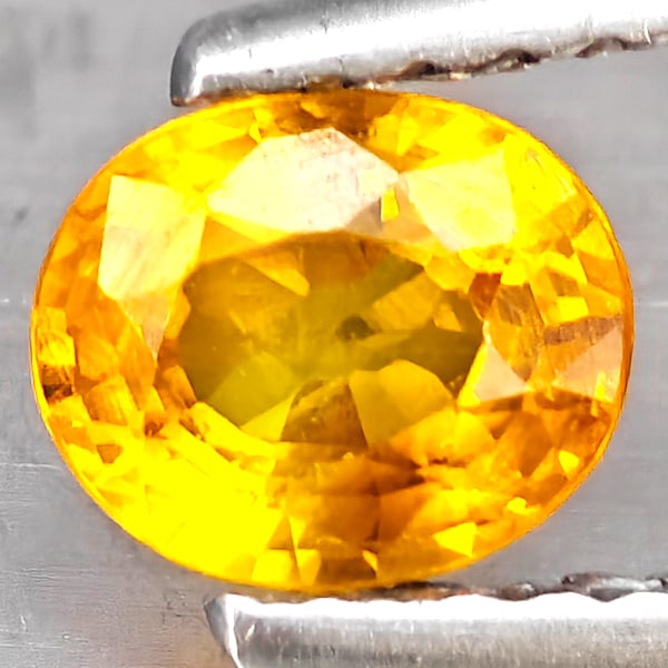 Natural Yellow Sapphire Gemstones 0.65 Ct. Oval Shape 5.6 x 4.8 Mm.: Product ID: 806163040 Product Name: Natural Yellow Sapphire Weight: 0.65 CT. Size: 5.6 x 4.8 x 3.1 MM. Shape: Oval Color: Yellow Clarity:VSI Luster: Good Gems Origin: Thailand Treatment: Heated Crysta