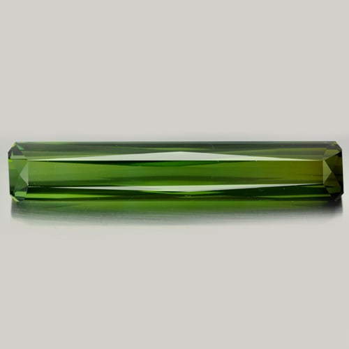 Natural Green Tourmaline Gemstones 20.66 Ct. Clean Octagon Shape 40.35 x 7.19 Mm.: Product ID: 807216366 Product Name: Natural Tourmaline Weight: 20.66 CT. Size: 40.35 x 7.19 x 6.57 MM. Shape: Octagon Color: Green Clarity:IF Luster: Good Gems Origin: Nigeria Treatment: Unheated Crys