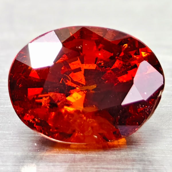 Natural Orange Spessartine Garnet Gemstones 0.90 Ct. Oval Shape 6 x 4.7 Mm.: Product ID: 102907031 Product Name: Natural Spessartine Weight: 0.90 CT. Size: 6 X 4.7 X 3.8 MM. Shape: OVAL Color: ORANGE Clarity:IF Luster: GOOD Gems Origin: MADAGASCAR Treatment: UNHEATED Crystal S