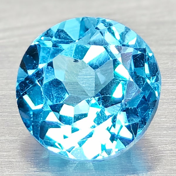 Natural Swiss Blue Topaz Gemstones 0.88 Ct. Round Shape 5.5 Mm.: Product ID: 807168119 Product Name: Natural Blue Topaz Weight: 0.88 CT. Size: 5.5 x 5.5 x 4 MM. Shape: Round Shape Color: Swiss Blue Clarity:VSI Luster: Good Gems Origin: Brazil Treatment: Treated Cry