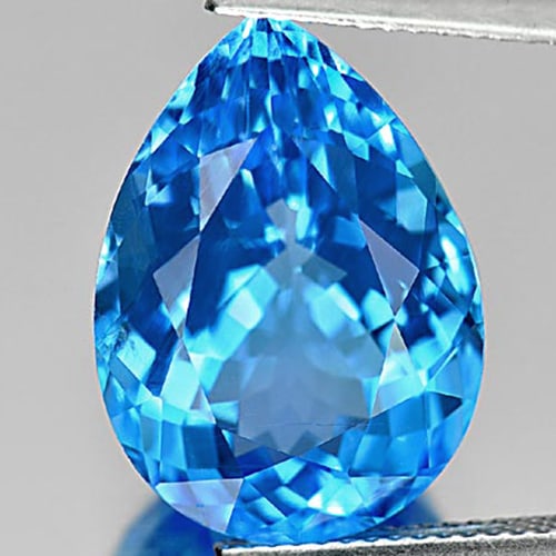 Natural Swiss Blue Topaz Gemstones 15.57 Ct. Pear Shape 18.6 x 13.5 Mm.: Product ID: 807164397 Product Name: Natural Blue Topaz Weight: 15.57 CT. Size: 18.6 x 13.5 x 9 MM. Shape: Pear Color: Blue Clarity:VSI Luster: Very Good Gems Origin: Brazil Treatment: Treated Crystal 