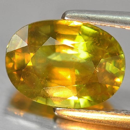 Natural Multi Color Sphene Gemstones With Rainbow Spark 3.03 Ct. Oval Shape 10.2 x 7.4 Mm.: Product ID: 806505801 Product Name: Natural Sphene Weight: 3.03 CT. Size: 10.2 x 7.4 x 4.8 MM. Shape: Oval Color: Multi Color Clarity:VSI Luster: Adamantine Gems Origin: Madagascar Treatment: Unheated