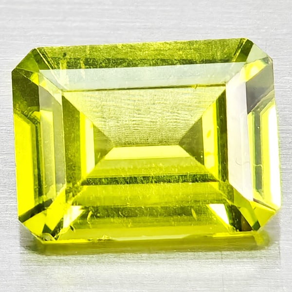Natural Green Peridot Gemstone 1.36 Ct. Octagon Shape 7.9 x 6 Mm.: Product ID: 805317157 Product Name: Natural Peridot Weight: 1.36 CT. Size: 7.9 x 6 x 3.3 MM. Shape: Octagon Shape Color: Green Clarity:SI1 Luster: Good Gems Origin: Pakistan Treatment: Unheated Crysta