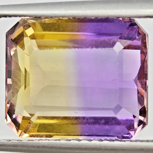 Natural Bi Color Ametrine Gemstones 4.62 Ct. Octagon Shape 11.4 x 9.6 Mm.: Product ID: 800408582 Product Name: Natural Ametrine Weight: 4.62 CT. Size: 11.4 x 9.6 x 6.2 MM. Shape: Octagon Color: Bi Color Clarity:VSI Luster: Good Gems Origin: Bolivia Treatment: Unheated Crysta