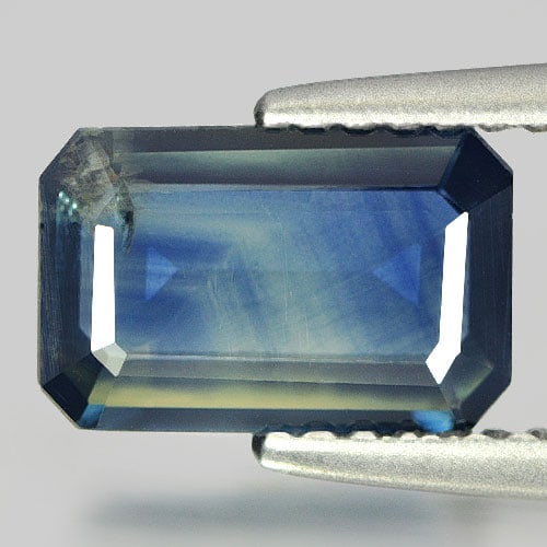 Natural Greenish Blue Sapphire Gemstones 1.63 Ct. Octagon Shape 9 x 6 Mm.: Product ID: 806144194 Product Name: Natural Blue Sapphire Weight: 1.63 CT. Size: 9 x 6 x 2.3 MM. Shape: Octagon Color: Bi-Color Clarity:VSI Luster: Good Gems Origin: Thailand Treatment: Heated Crystal