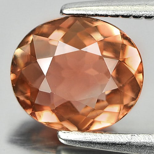 Natural Pinkish Orange Tourmaline Gemstones 0.92 Ct. Oval Shape 7 x 6.2 Mm.: Product ID: 807244079 Product Name: Natural Tourmaline Weight: 0.92 CT. Size: 7 x 6.2 x 3.2 MM. Shape: Oval Color: Pinkish Orange Clarity:VSI Luster: Good Gems Origin: Nigeria Treatment: Unheated Crys