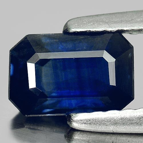 Natural Blue Sapphire Gemstones 0.99 Ct. Octagon Shape 7 x 4.6 Mm.: Product ID: 806007202 Product Name: Natural Blue Sapphire Weight: 0.99 CT. Size: 7 x 4.6 x 3 MM. Shape: Octagon Color: Blue Clarity:VVS Luster: Good Gems Origin: Thailand Treatment: Heated Crystal Str