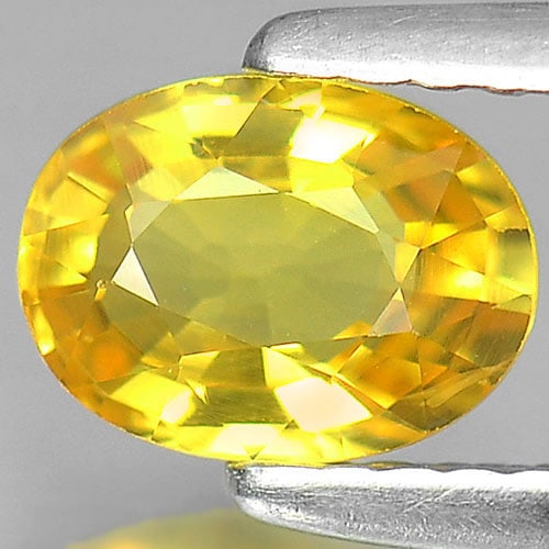 Natural Yellow Sapphire Gemstones 1.06 Ct. Oval Shape 7 x 5.2 Mm.: Product ID: 806150913 Product Name: Natural Yellow Sapphire Weight: 1.06 CT. Size: 7 x 5.2 x 3.3 MM. Shape: Oval Color: Yellow Clarity:VS Luster: Very Good Gems Origin: Thailand Treatment: Heated Crys