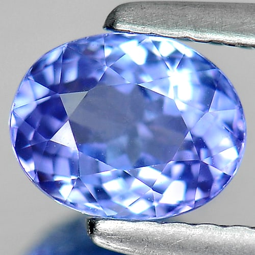 Natural Violet Blue Tanzanite Gemstones 0.94 Ct. Clean Oval Shape 6.5 x 5.2 Mm.: Product ID: 807004501 Product Name: Natural Tanzanite Weight: 0.94 CT. Size: 6.5 x 5.2 x 3.8 MM. Shape: Oval Color: Violet Blue Clarity:IF Luster: Good Gems Origin: Tanzania Treatment: Heated Crystal 