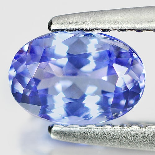 Natural Violet Blue Tanzanite Gemstones 0.79 Ct. Oval Shape 6.8 x 4.7 Mm.: Product ID: 807004661 Product Name: Natural Tanzanite Weight: 0.79 CT. Size: 6.8 x 4.7 x 3.4 MM. Shape: Oval Color: Violet Blue Clarity:SI Luster: Good Gems Origin: Tanzania Treatment: Heated Crystal 