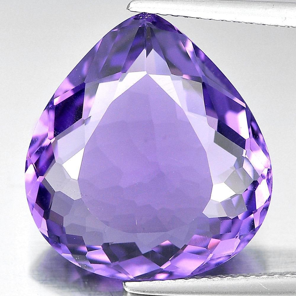 Natural Purple Amethyst Gemstones 13.85 Ct. Pear Shape 19.1 x 17.6 Mm.: Product ID: 800320574 Product Name: Natural Amethyst Weight: 13.85 CT. Size: 19.1 x 17.6 x 7.5 MM. Shape: Pear Color: Purple Clarity:VSI Luster: Very Good Gems Origin: Brazil Treatment: Unheated Cryst