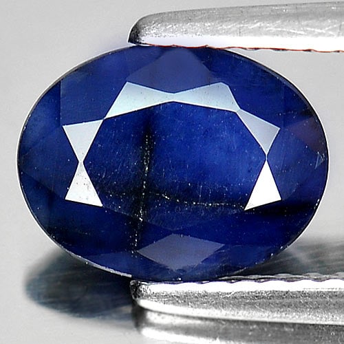 Natural Deep Blue Sapphire Gemstones 1.91 Ct. Oval Shape 9 x 7 Mm.: Product ID: 806011146 Product Name: Natural Blue Sapphire Weight: 1.91 CT. Size: 9 x 7 x 3.8 MM. Shape: Oval Color: Deep Blue Clarity:Opaque Luster: Good Gems Origin: Madagascar Treatment: Heated (Lea