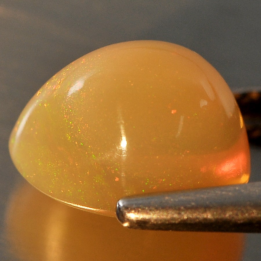 Natural Multi Color Opal Gemstones 1.83 Ct. Pear Cabochone Shape 9 x 7.2 Mm.: Product ID: 818707742 Product Name: Natural Opal Weight: 1.83 CT. Size: 9 x 7.2 x 6 MM. Shape: Pear Cabochon Color: Multi Color Clarity:Semi - Transparent Luster: Good Gems Origin: Ethiopia Treatment: