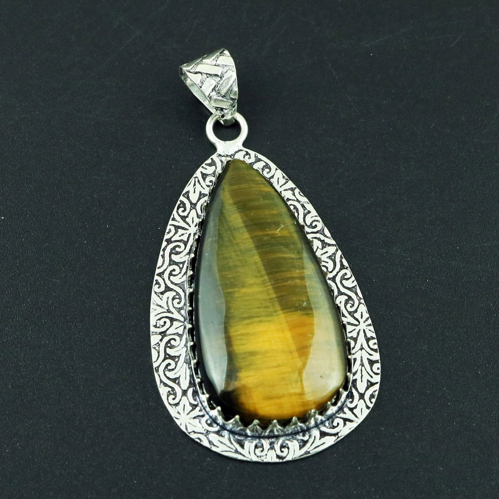 Natural Tiger Eye Silver Plated Handmade Pendant: Product ID: 260328174333 Product - Handmade Silver Plated Pendant Metal - 925 Sterling Silver Plated Pendant Size - 4.5x2.5 CM Gemstone - Tiger Eye Gemstone Origin - South Africa Gemstone Shape - Pear