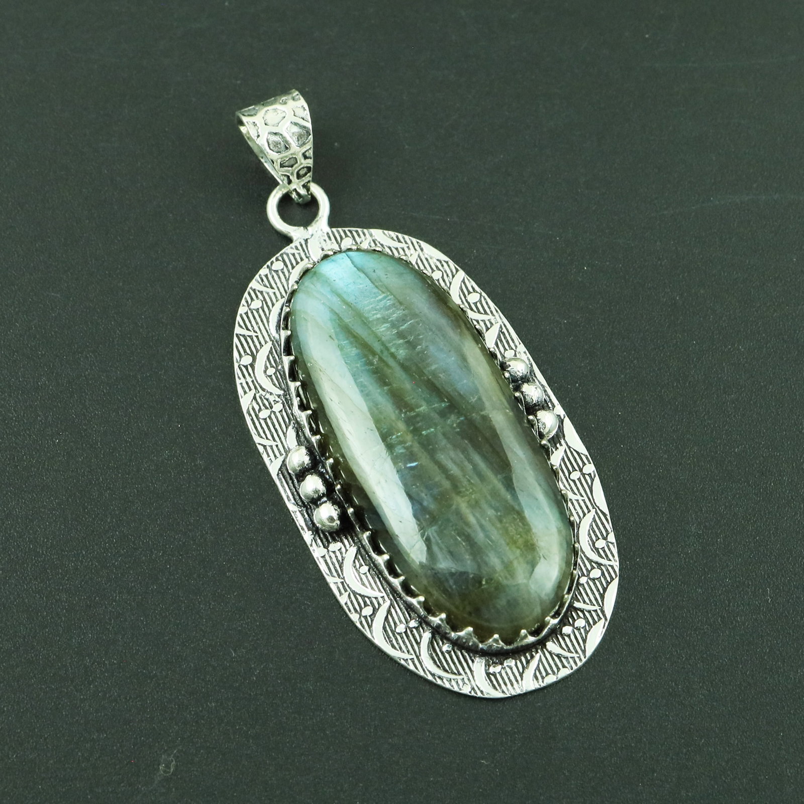 Natural Labradorite Silver Plated Handmade Pendant: Product ID: 260328173656 Product - Handmade Silver Plated Pendant Metal - 925 Sterling Silver Plated Pendant Size - 4.5x2.5 CM Gemstone - Labradorite Gemstone Origin - Canada Gemstone Shape - Oval Pen