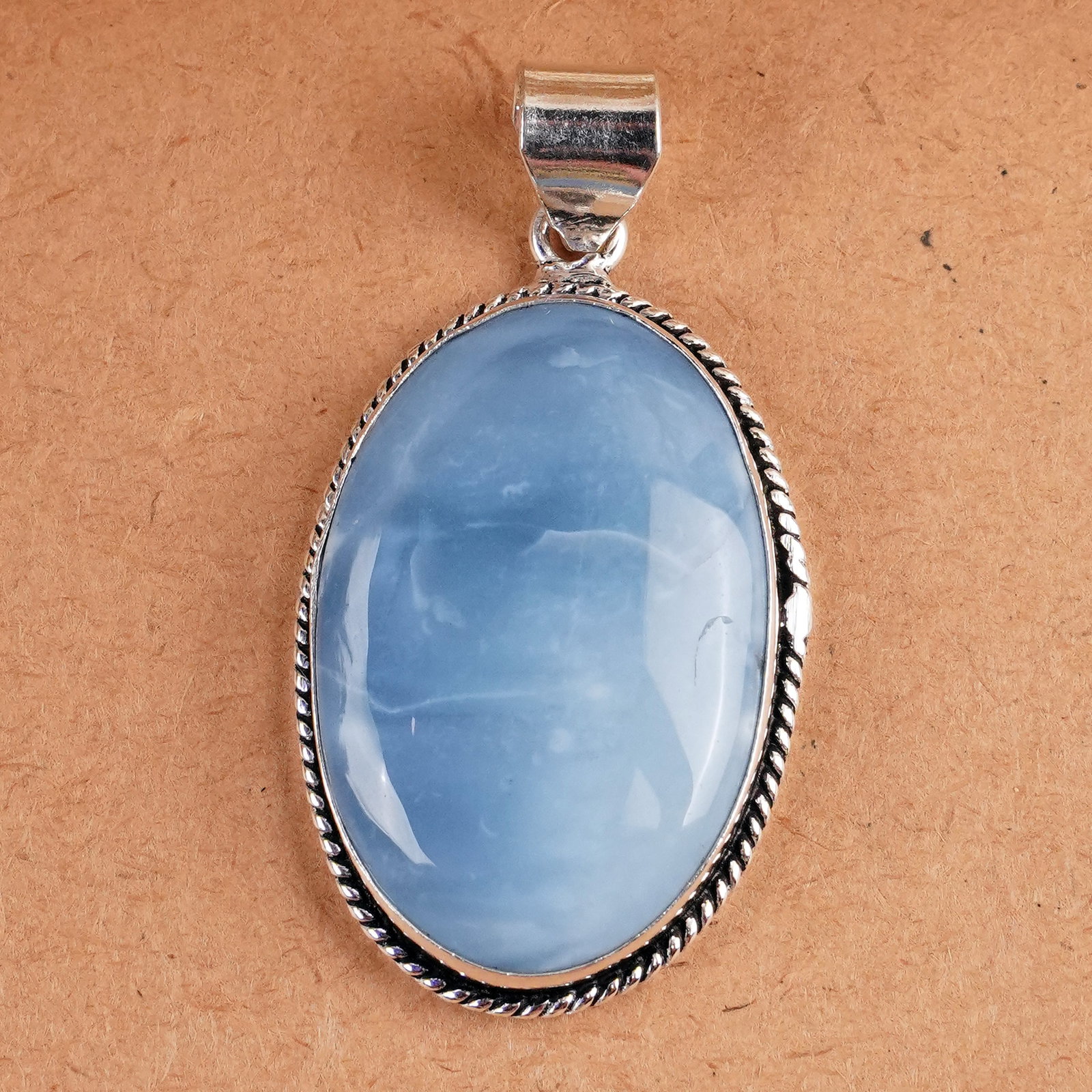 Natural Blue Opal Silver Plated Handmade Pendant: Product ID: 260407165134 Product - Handmade Silver Plated Pendant Metal - 925 Sterling Silver Plated Pendant Size - 4x2.5 CM Gemstone - Blue Opal Gemstone Origin - Indonesia Gemstone Shape - Oval Pend