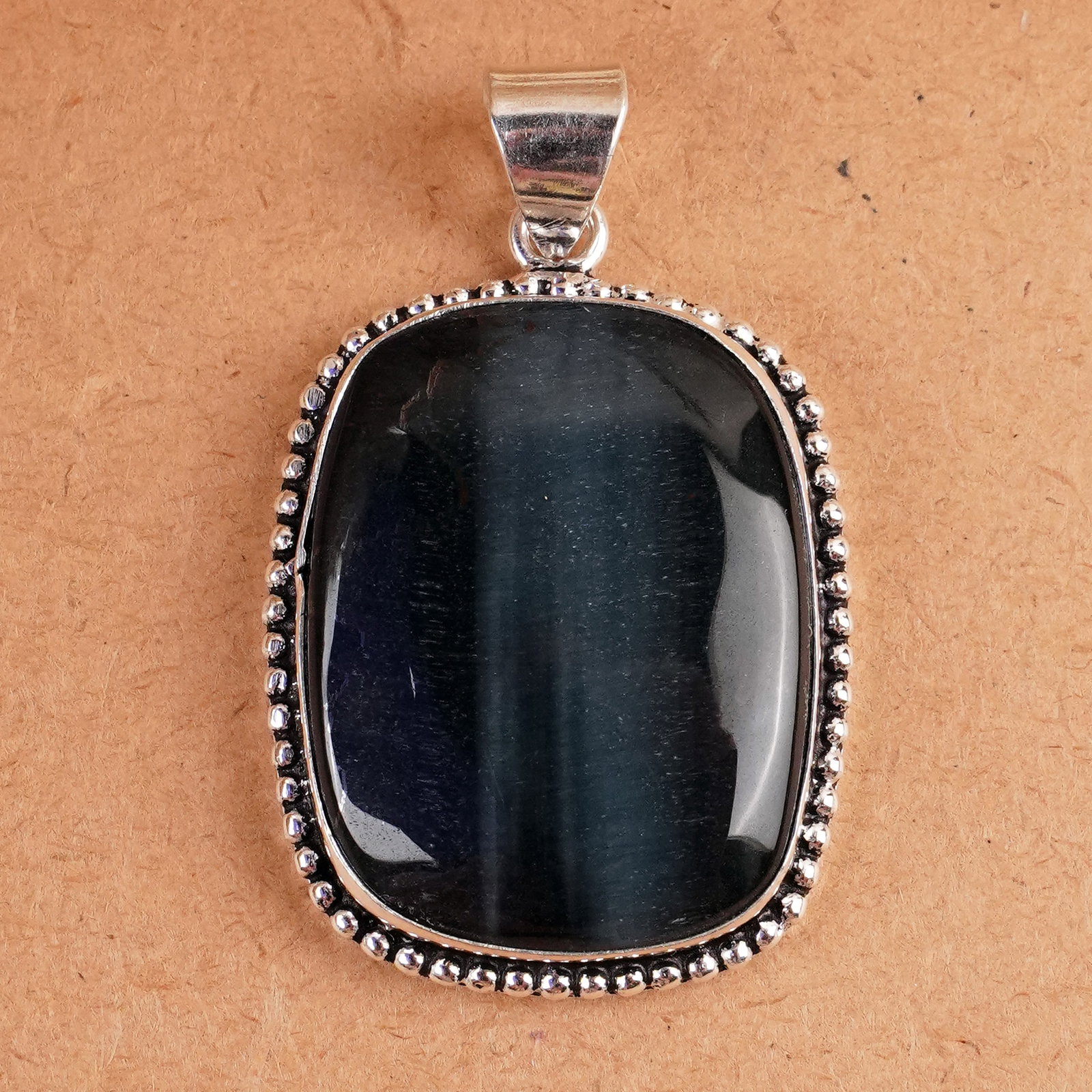 Natural Blue Tiger Eye Silver Plated Handmade Pendant: Product ID: 260407160017 Product - Handmade Silver Plated Pendant Metal - 925 Sterling Silver Plated Pendant Size - 3x3.5 CM Gemstone - Blue Tiger Eye Gemstone Origin - South Africa Gemstone Shape - S