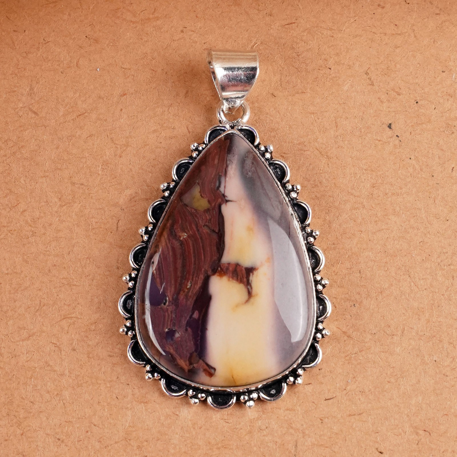 Natural Mookaite Jasper Silver Plated Handmade Pendant: Product ID: 260407162853 Product - Handmade Silver Plated Pendant Metal - 925 Sterling Silver Plated Pendant Size - 4.5x3 CM Gemstone - Mookaite Jasper Gemstone Origin - Australia Gemstone Shape - Pea