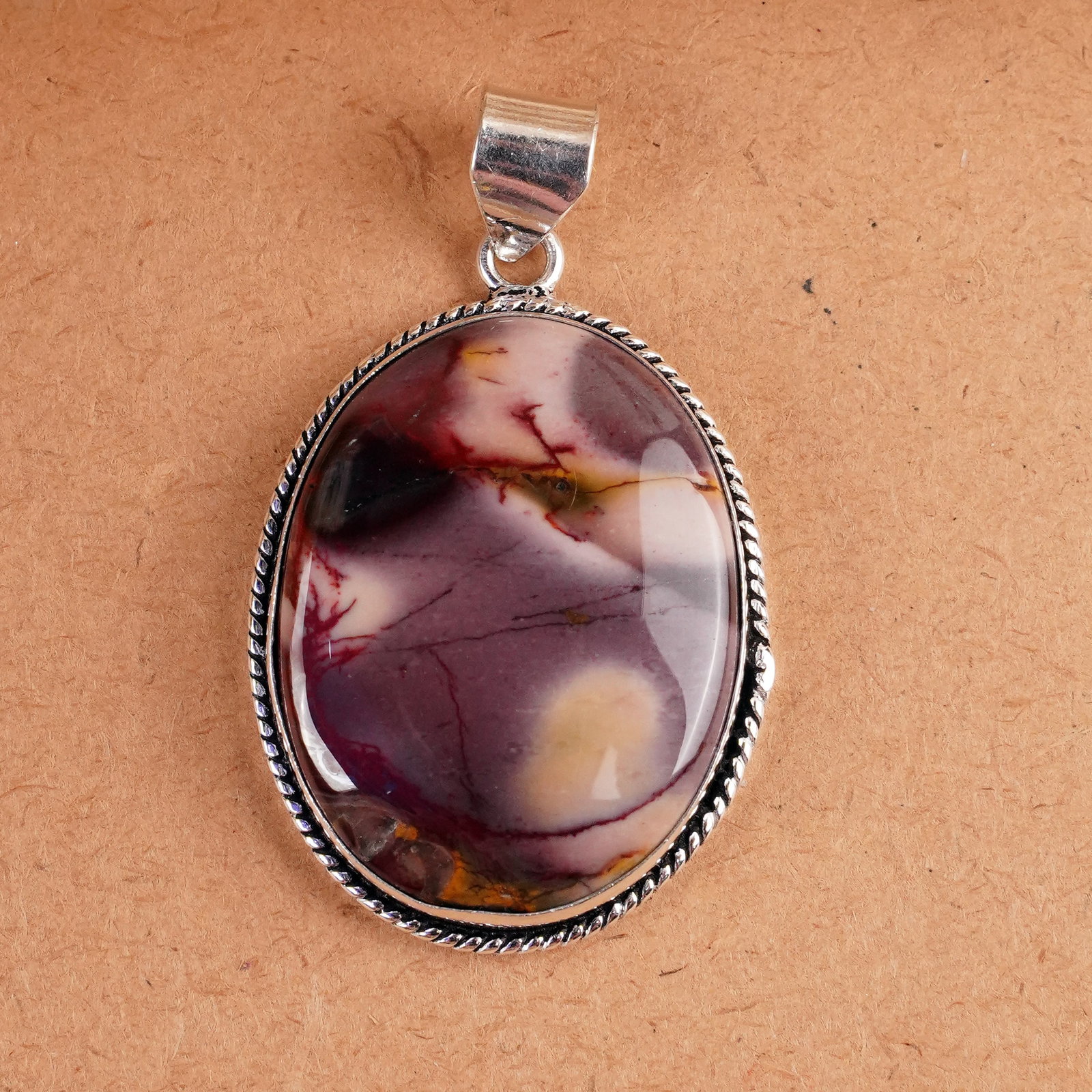 Natural Mookaite Jasper Silver Plated Handmade Pendant: Product ID: 260407162634 Product - Handmade Silver Plated Pendant Metal - 925 Sterling Silver Plated Pendant Size - 4x3 CM Gemstone - Mookaite Jasper Gemstone Origin - Australia Gemstone Shape - Oval 