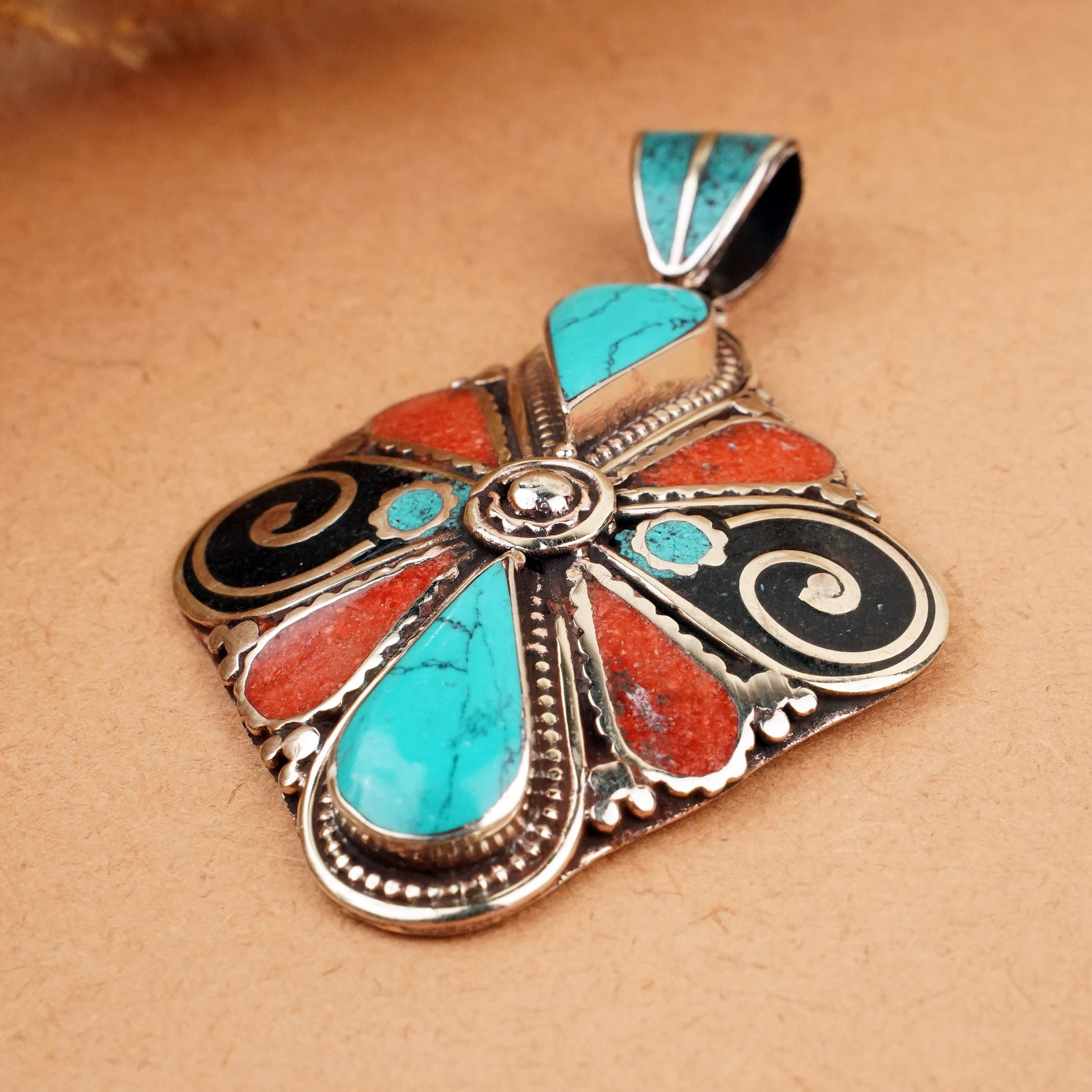 Tibetan Turquoise & Coral Handmade Ethnic Pendant: Product ID: 260407143209 Product - Tibetan Natural Handmade Pendant Gemstone - Natural Turquoise & Coral Pendant Size - 6X5 CM Pendant Weight - 25 Gram Metal - Brass & Copper mix Metal Origin - Nepal 