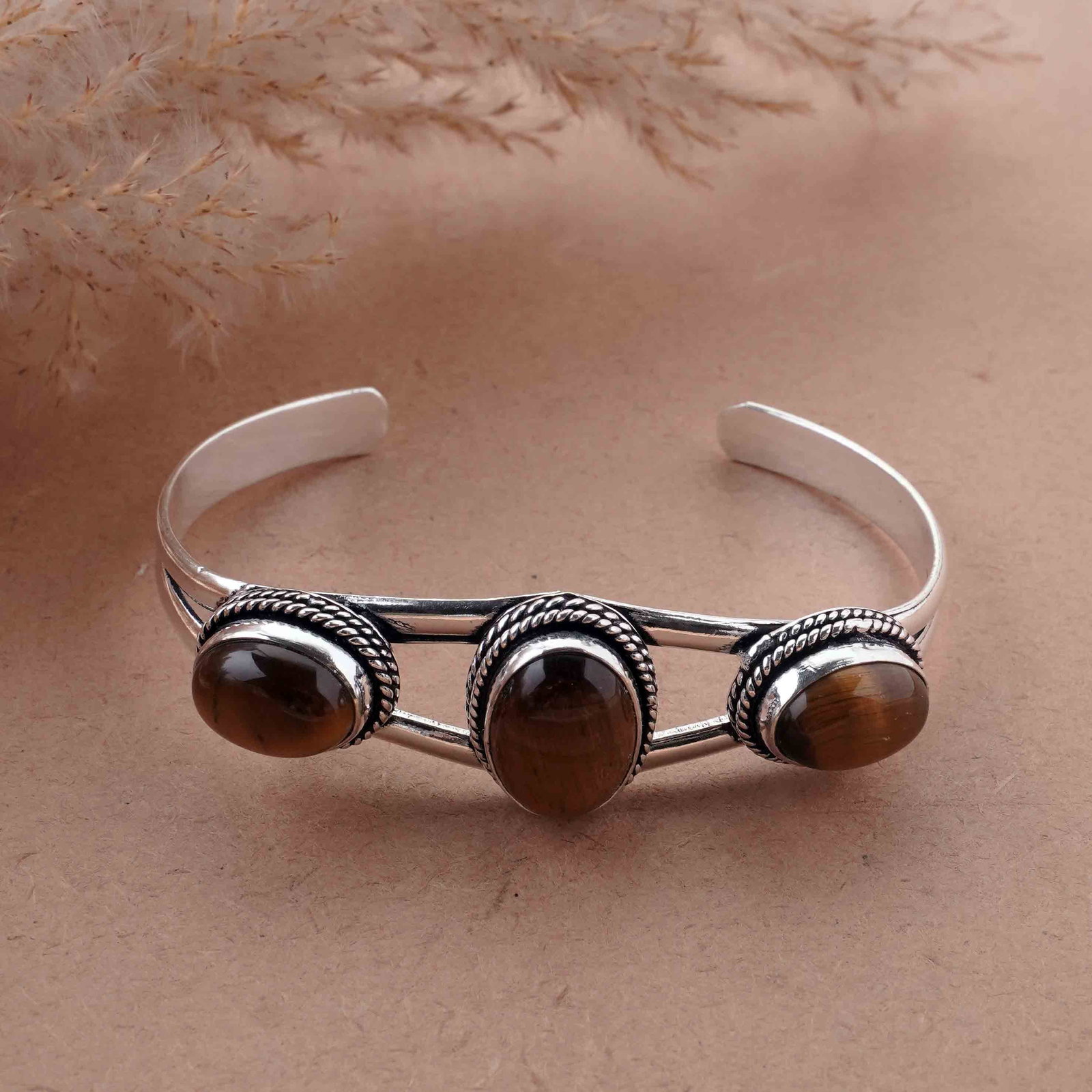 Natural Tiger Eye Silver Plated Handmade Cuff Bangle: Product ID: 260417180743 Product - Handmade Silver Plated Cuff Bangle Metal - 925 Sterling Silver Plated Bangle Size - 6.5x4.5 CM (Adjustable) Gemstone - Tiger Eye Gemstone Origin - South Africa Gemst