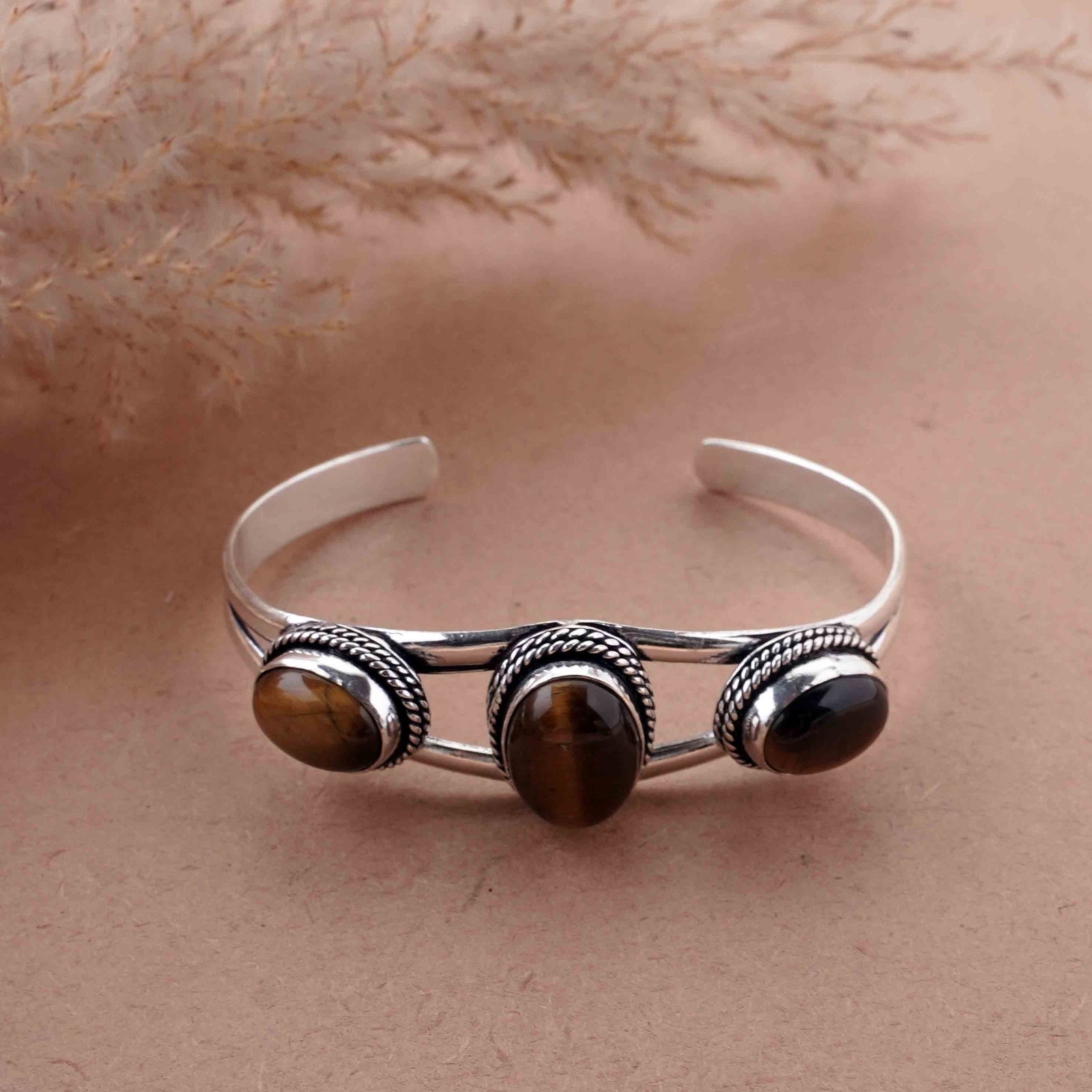 Natural Tiger Eye Silver Plated Handmade Cuff Bangle: Product ID: 260417180615 Product - Handmade Silver Plated Cuff Bangle Metal - 925 Sterling Silver Plated Bangle Size - 6.5x4.5 CM (Adjustable) Gemstone - Tiger Eye Gemstone Origin - South Africa Gemst