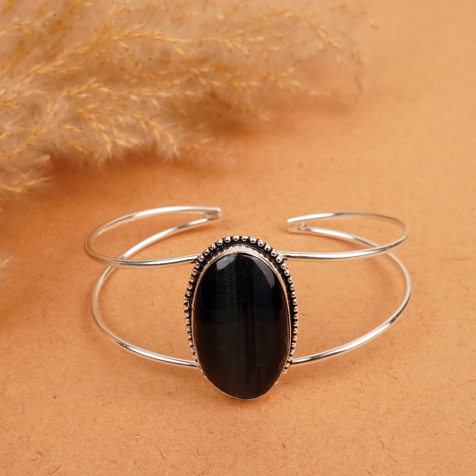 Natural Black Tiger Eye Silver Plated Handmade Cuff Bangle: Product ID: 260412110603 Product - Handmade Silver Plated Cuff Bangle Metal - 92.5 Sterling Silver Plated Bangle Size - 7.5x5.5 CM (Adjustable) Gemstone - Black Tiger Eye Gemstone Origin - South Afric