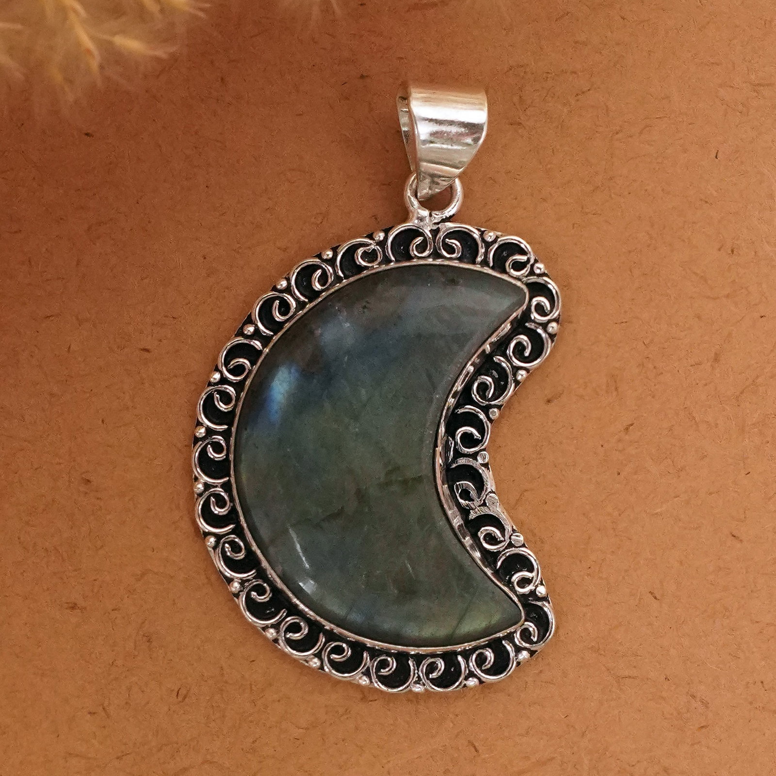 Natural Labradorite Silver Plated Handmade Moon Pendant: Product ID: 260411135240 Product - Handmade Silver Plated Pendant Metal - 92.5 Sterling Silver Plated Pendant Size - 4x2.5 CM Gemstone - Labradorite Gemstone Origin - Canada Gemstone Shape - Crescent 