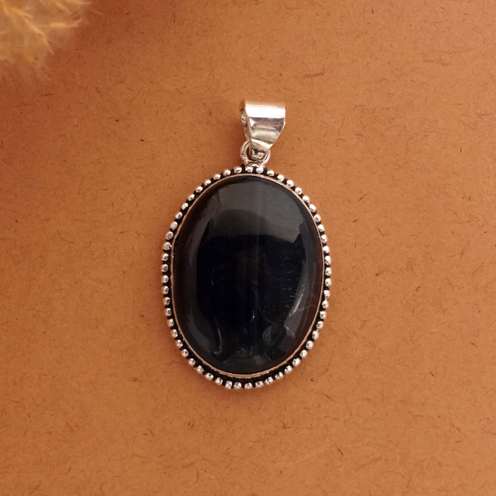 Natural Black Tiger Eye Silver Plated Handmade Pendant: Product ID: 260411122210 Product - Handmade Silver Plated Pendant Metal - 92.5 Sterling Silver Plated Pendant Size - 4x3 CM Gemstone - Black Tiger Eye Gemstone Origin - South Africa Gemstone Shape - O