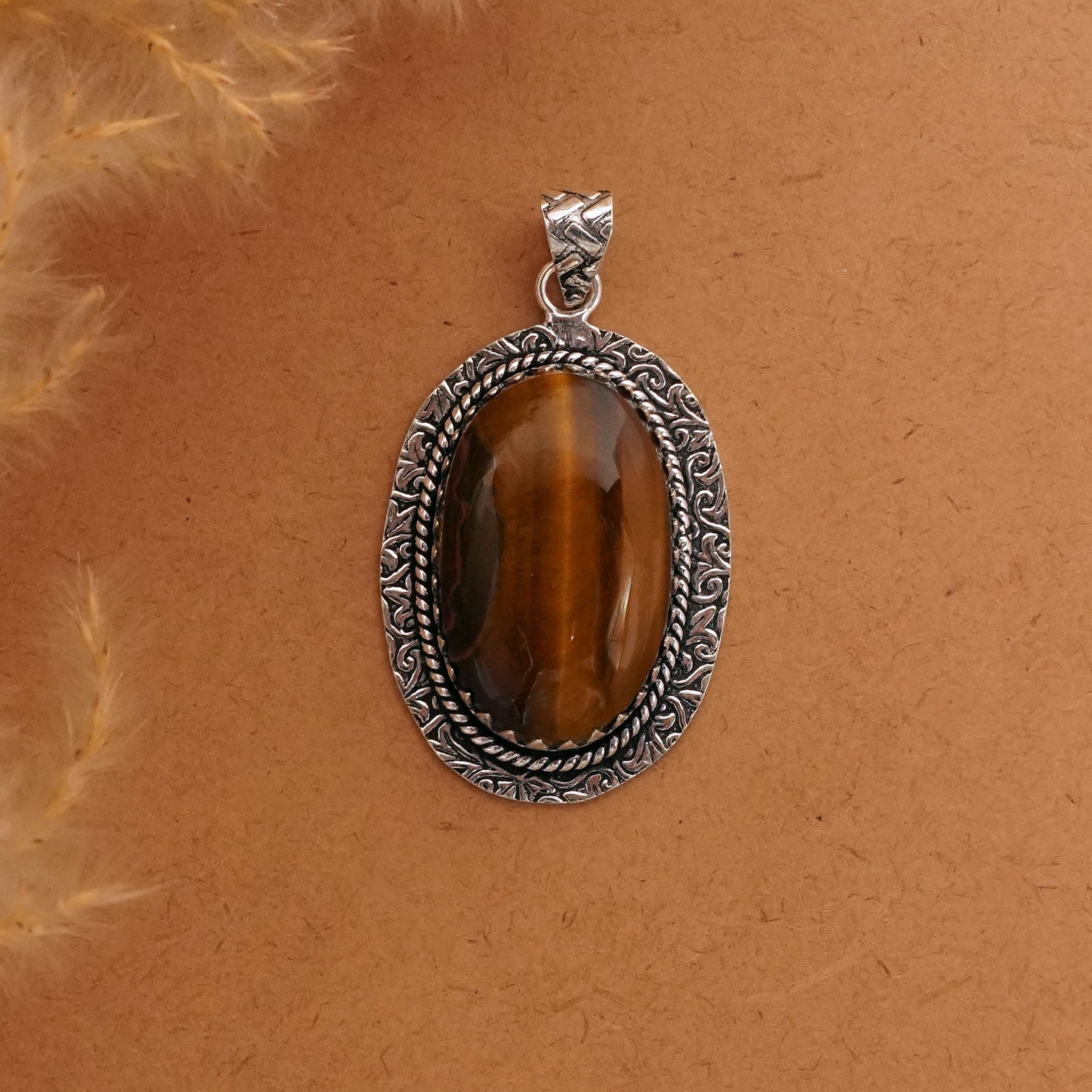 Natural Tiger Eye Silver Plated Handmade Pendant: Product ID: 260411121829 Product - Handmade Silver Plated Pendant Metal - 92.5 Sterling Silver Plated Pendant Size - 4x3 CM Gemstone - Tiger Eye Gemstone Origin - South Africa Gemstone Shape - Oval Pe