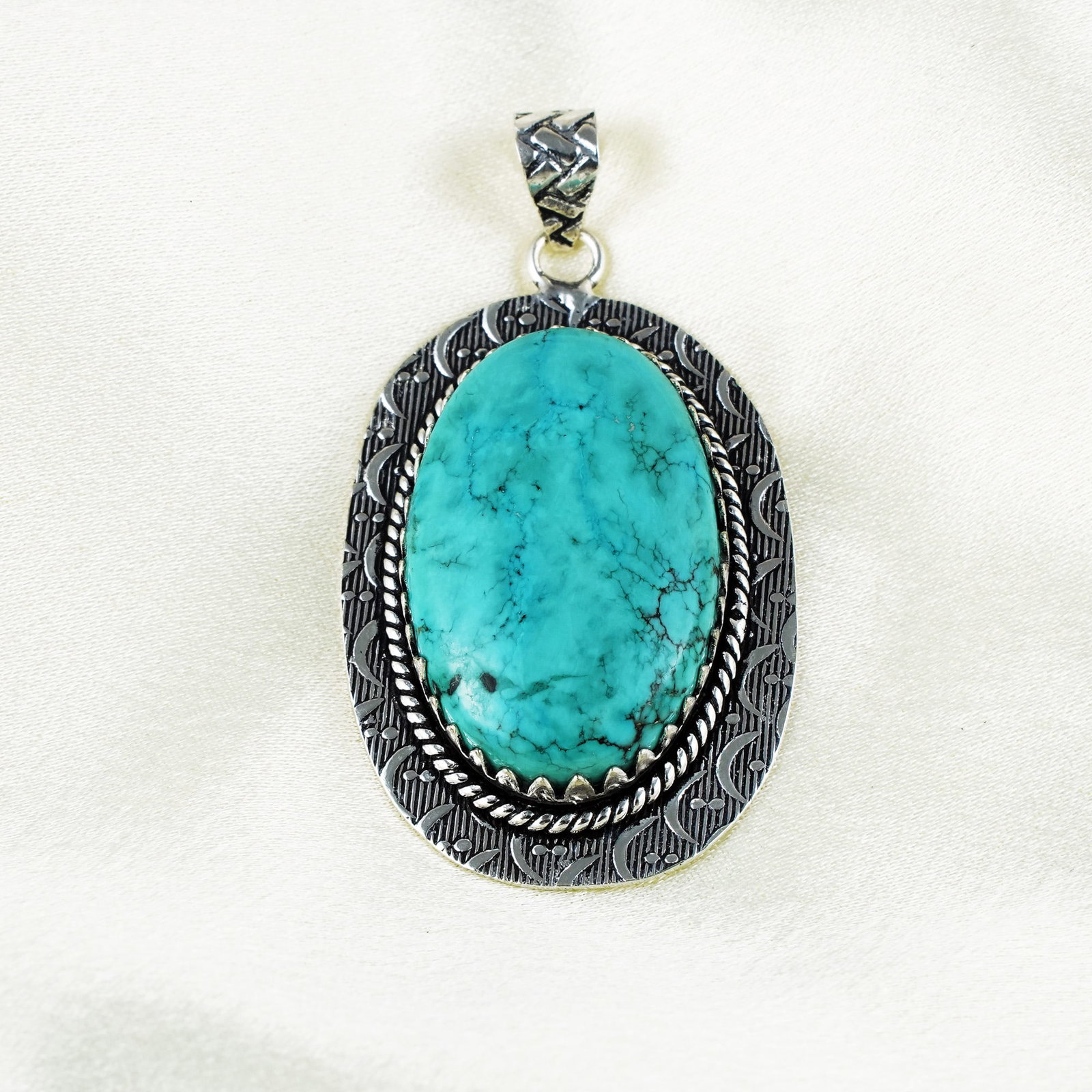 Natural Turquoise Silver Plated Handmade Pendant: Product ID: 260401131759 Product - Handmade Silver Plated Pendant Metal - 92.5 Sterling Silver Plated Pendant Size - 4.5x3 CM Gemstone - Turquoise Gemstone Origin - Tibet Gemstone Shape - Oval Pendant