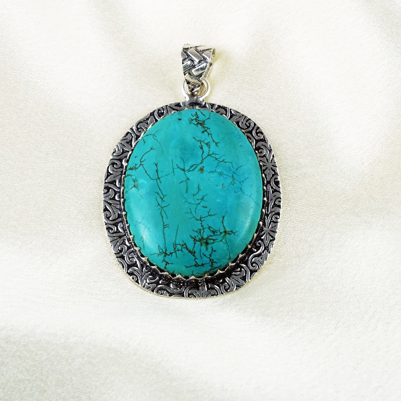 Natural Turquoise Silver Plated Handmade Pendant: Product ID: 260401131428 Product - Handmade Silver Plated Pendant Metal - 92.5 Sterling Silver Plated Pendant Size - 3.5x3 CM Gemstone - Turquoise Gemstone Origin - Tibet Gemstone Shape - Oval Pendant