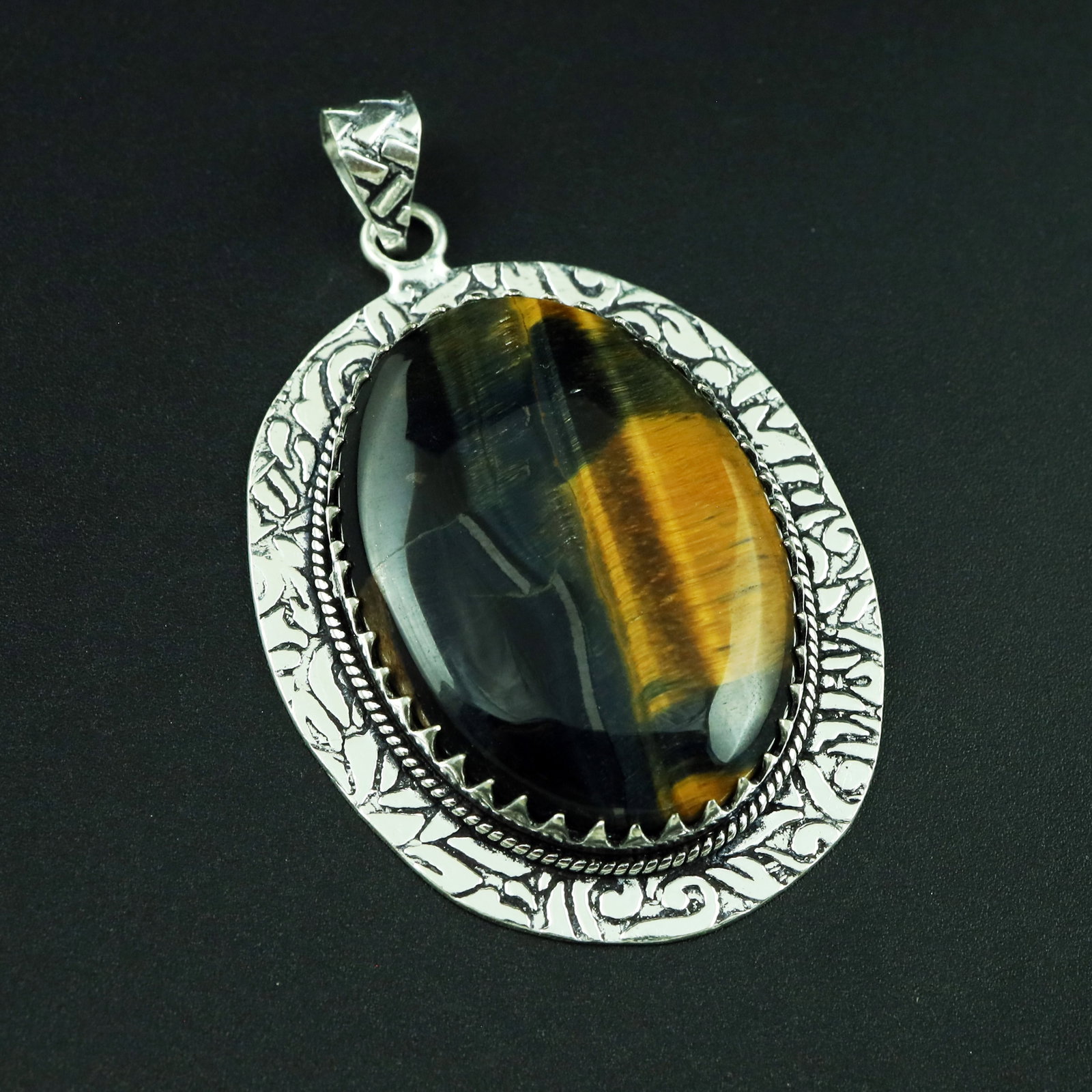 Natural Black Tiger Eye Silver Plated Handmade Pendant: Product ID: 260328111928 Product - Handmade Silver Plated Pendant Metal - 92.5 Sterling Silver Plated Pendant Size - 4.5x3.5 CM Gemstone - Black Tiger Eye Gemstone Origin - South Africa Gemstone Shape