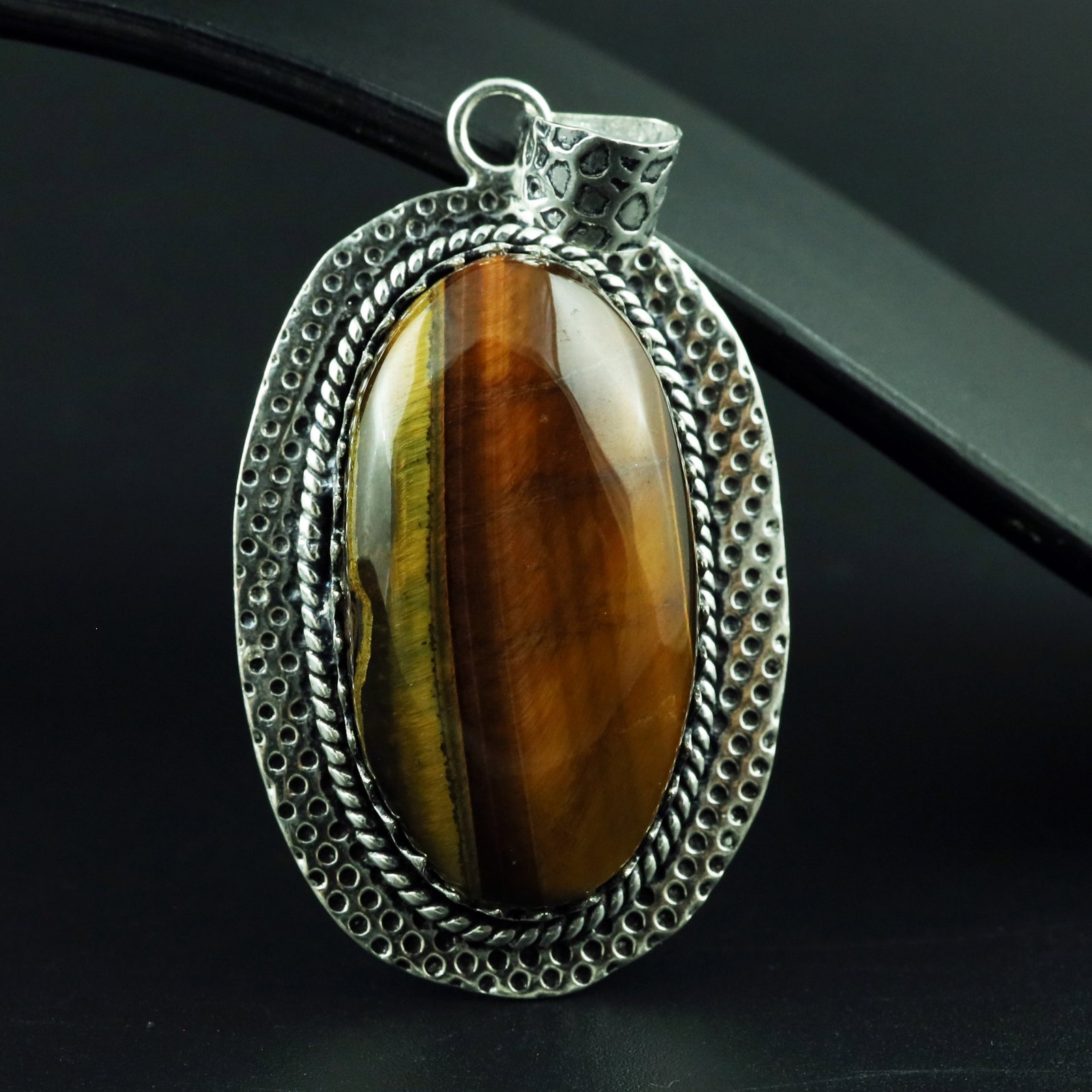 Natural Tiger Eye Silver Plated Handmade Royal Pendant: Product ID: 260328110401 Product - Handmade Silver Plated Pendant Metal - 92.5 Sterling Silver Plated Pendant Size - 4.5x3 CM Gemstone - Tiger Eye Gemstone Origin - South Africa Gemstone Shape - Oval 