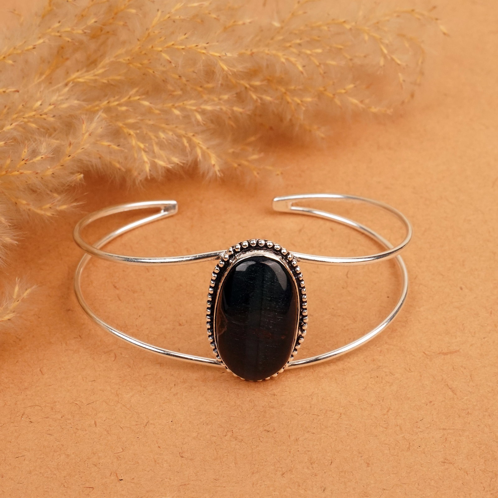 Natural Black Tiger Eye Silver Plated Handmade Cuff Bangle: Product ID: 260412120615 Product - Handmade Silver Plated Cuff Bangle Metal - 92.5 Sterling Silver Plated Bangle Size - 7.5x5.5 CM (Adjustable) Gemstone - Black Tiger Eye Gemstone Origin - South Afric