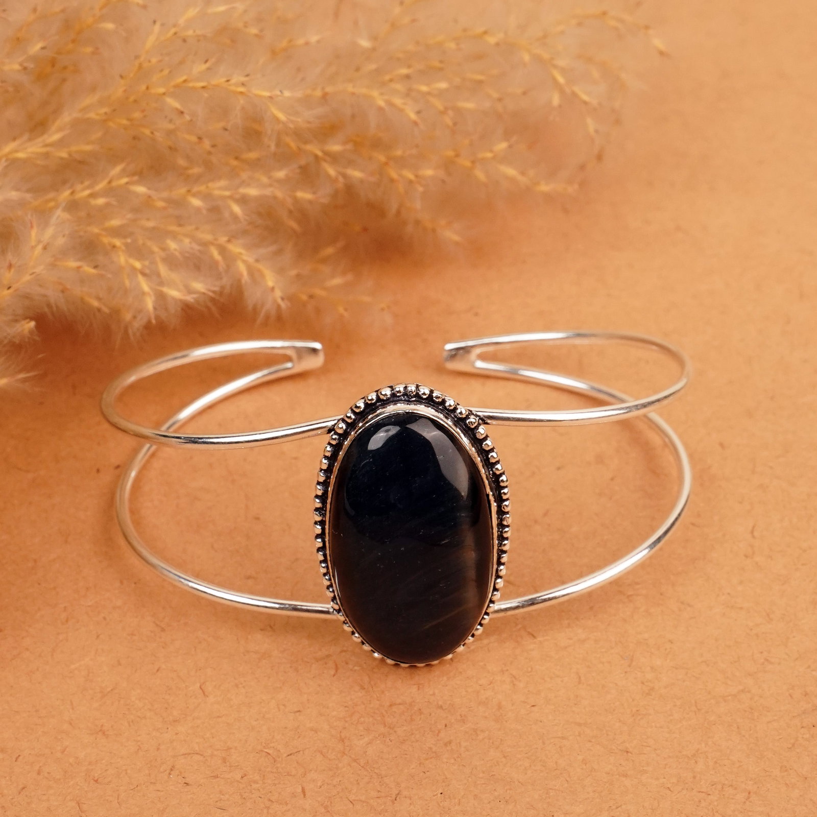 Natural Black Tiger Eye Silver Plated Handmade Cuff Bangle: Product ID: 260412120502 Product - Handmade Silver Plated Cuff Bangle Metal - 92.5 Sterling Silver Plated Bangle Size - 7.5x5.5 CM (Adjustable) Gemstone - Black Tiger Eye Gemstone Origin - South Afric