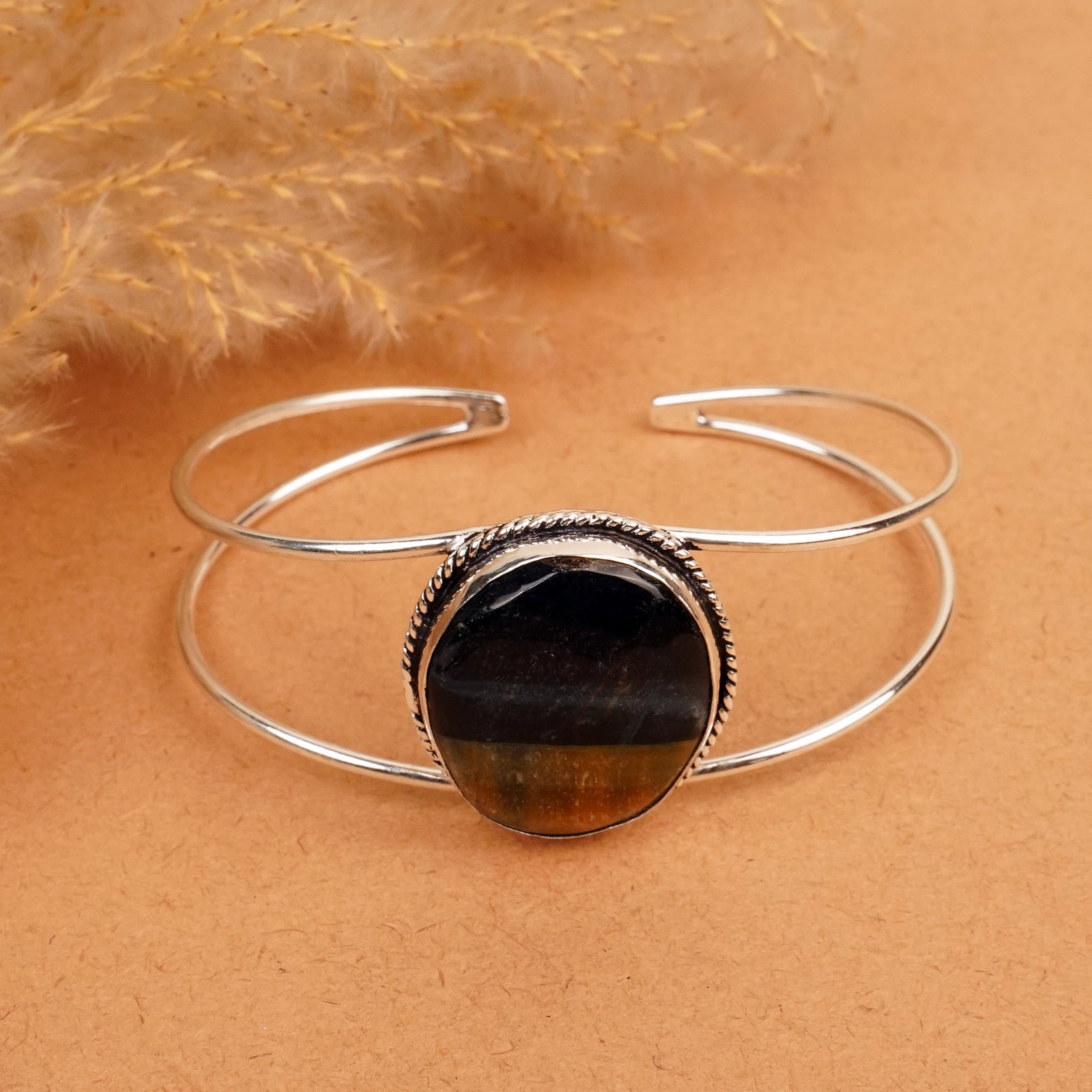 Natural Black Tiger Eye Silver Plated Handmade Cuff Bangle: Product ID: 260412120341 Product - Handmade Silver Plated Cuff Bangle Metal - 92.5 Sterling Silver Plated Bangle Size - 7.5x5.5 CM (Adjustable) Gemstone - Black Tiger Eye Gemstone Origin - South Afric