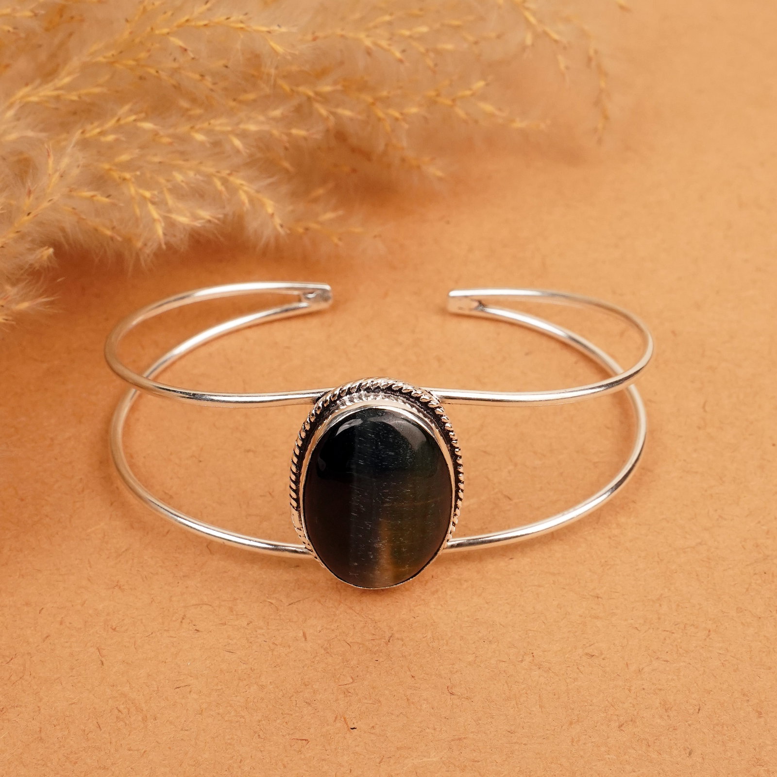 Natural Black Tiger Eye Silver Plated Handmade Cuff Bangle: Product ID: 260412120025 Product - Handmade Silver Plated Cuff Bangle Metal - 92.5 Sterling Silver Plated Bangle Size - 7.5x5.5 CM (Adjustable) Gemstone - Black Tiger Eye Gemstone Origin - South Afric