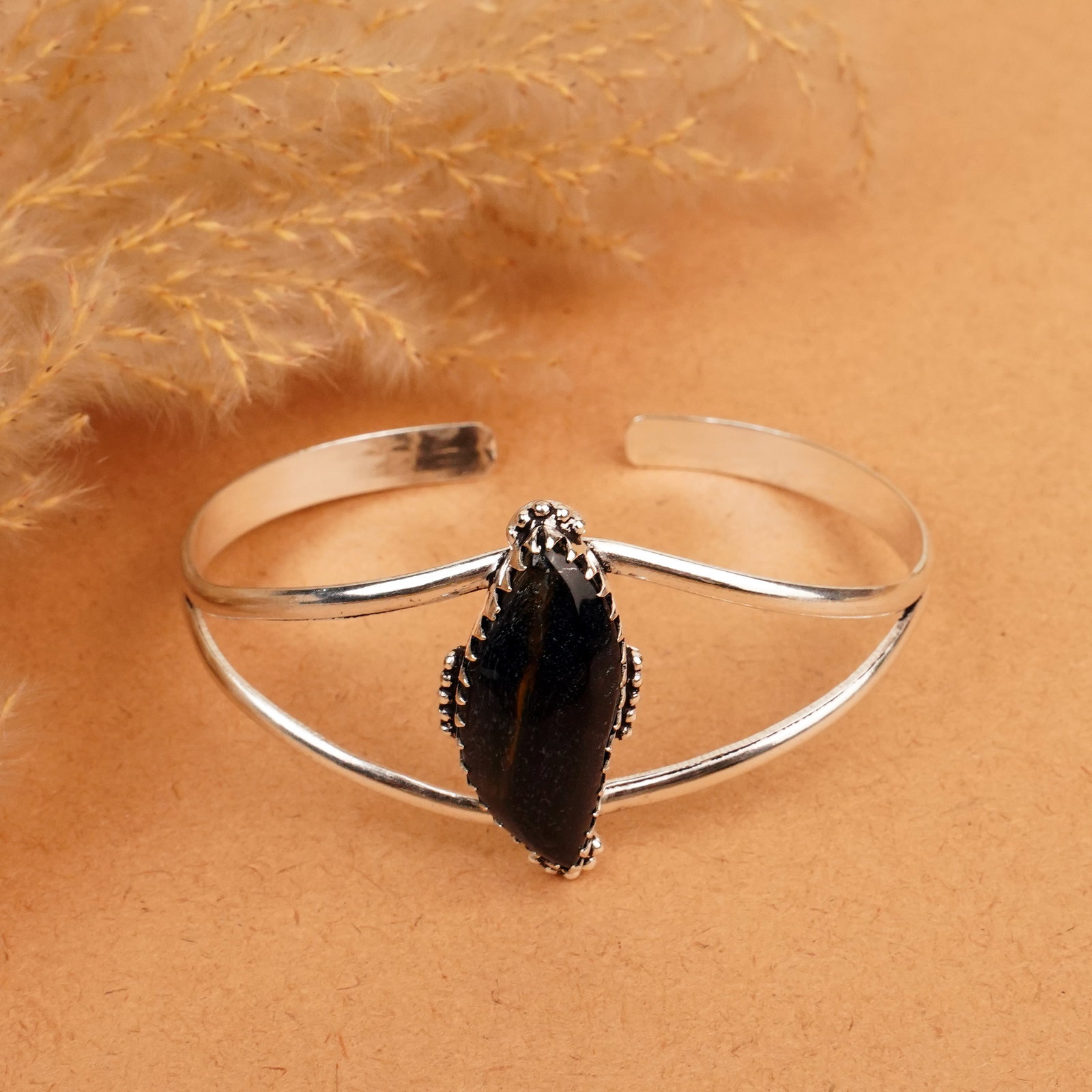 Natural Black Tiger Eye Silver Plated Handmade Cuff Bangle: Product ID: 260412112907 Product - Handmade Silver Plated Cuff Bangle Metal - 92.5 Sterling Silver Plated Bangle Size - 7x5.5 CM (Adjustable) Gemstone - Black Tiger Eye Gemstone Origin - South Africa 
