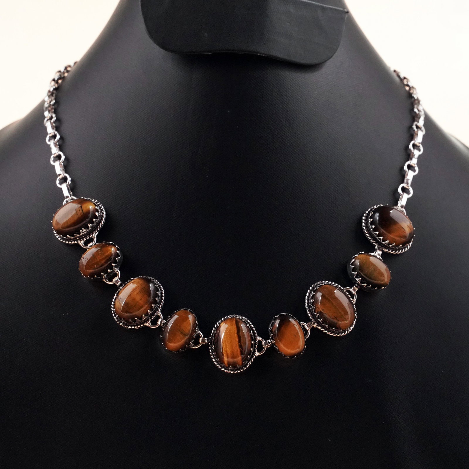 Natural Tiger Eye Silver Plated Handmade Choker Necklace: Product ID: 260503125643 Product - Handmade Silver Plated Necklace Metal - 92.5 Sterling Silver Plated Necklace Length - 18 Inch Gemstone - Tiger Eye Gemstone Size - 12X16 MM (5 Stone), 10X14 MM (4 St