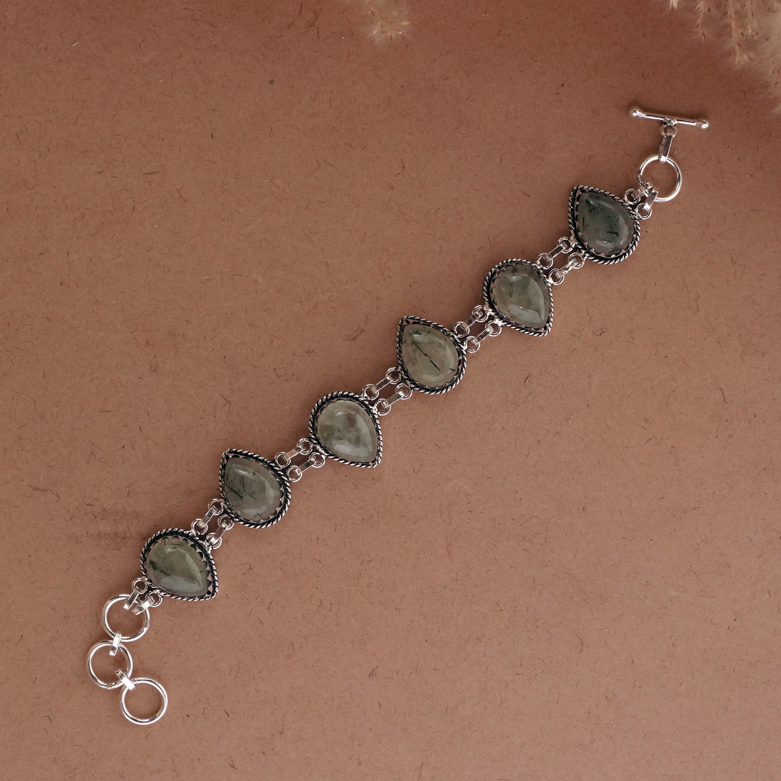 Natural Prehnite Sterling Silver Plated Handmade Bracelet: Product ID: 260502115445 Product - Handmade Silver Plated Bracelet Metal - 92.5Sterling Silver Plated Bracelet Length - 6 Inch + 2 Inch Gemstone - Prehnite Gemstone Size -12X16 ( 6 Stone) Gemstone Ori