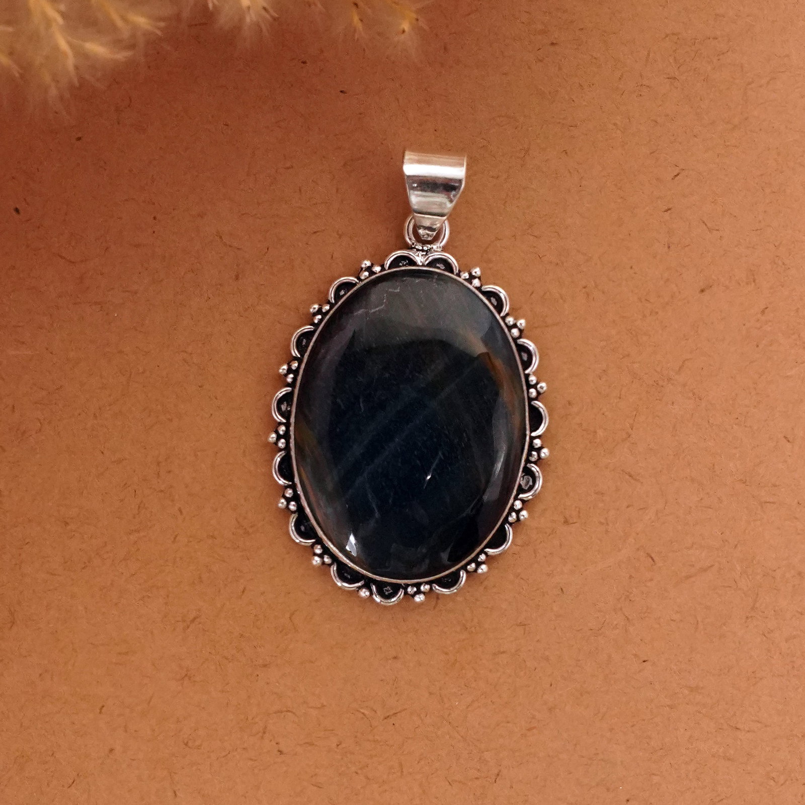 Natural Black Tiger Eye Silver Plated Handmade Pendant: Product ID: 260411134610 Product - Handmade Silver Plated Pendant Metal - 92.5 Sterling Silver Plated Pendant Size - 4x3 CM Gemstone - Black Tiger Eye Gemstone Origin - South Africa Gemstone Shape - O