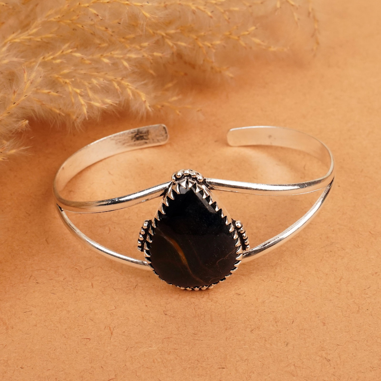 Natural Black Tiger Eye Silver Plated Handmade Cuff Bangle: Product ID: 260412112411 Product - Handmade Silver Plated Cuff Bangle Metal - 92.5 Sterling Silver Plated Bangle Size - 7x5.5 CM (Adjustable) Gemstone - Black Tiger Eye Gemstone Origin - South Africa 