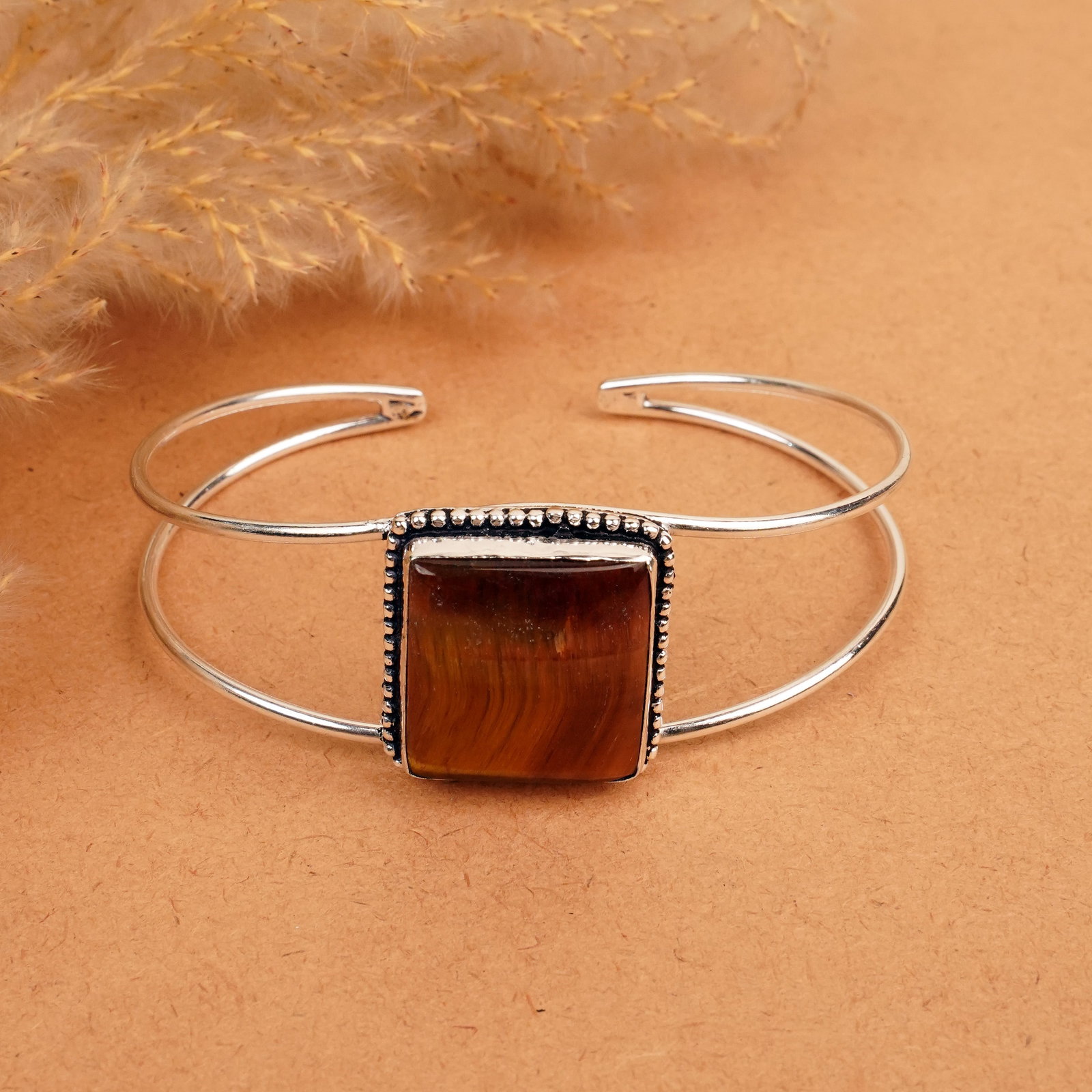 Natural Tiger Eye Silver Plated Handmade Cuff Bangle: Product ID: 260412120152 Product - Handmade Silver Plated Cuff Bangle Metal - 92.5 Sterling Silver Plated Bangle Size - 7.5x5.5 CM (Adjustable) Gemstone - Tiger Eye Gemstone Origin - South Africa Gems