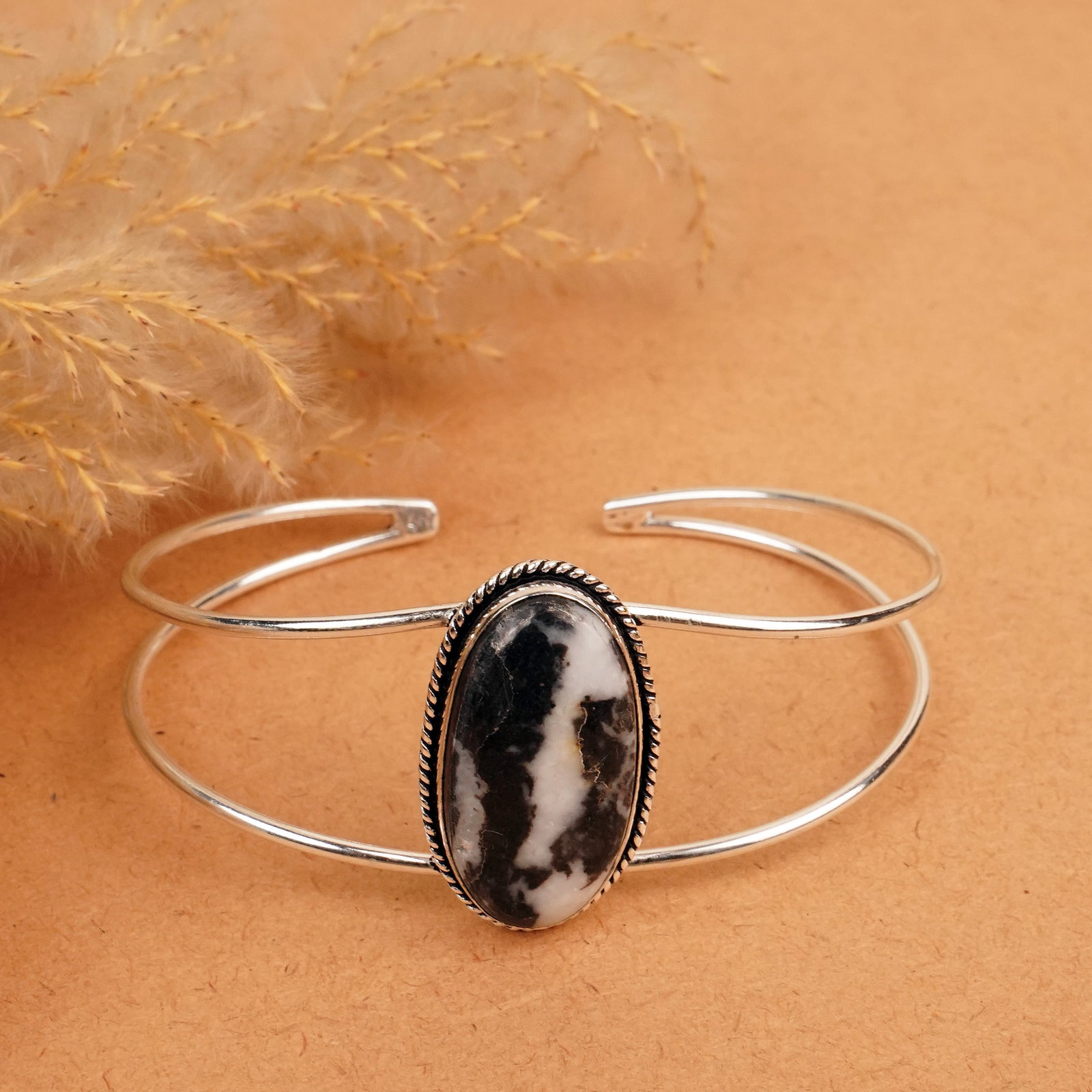 Natural Zebra Jasper Silver Plated Handmade Cuff Bangle: Product ID: 260412132413 Product - Handmade Silver Plated Cuff Bangle Metal - 92.5 Sterling Silver Plated Bangle Size - 7.5x5.5 CM (Adjustable) Gemstone - Zebra Jasper Gemstone Origin - Africa Gemston