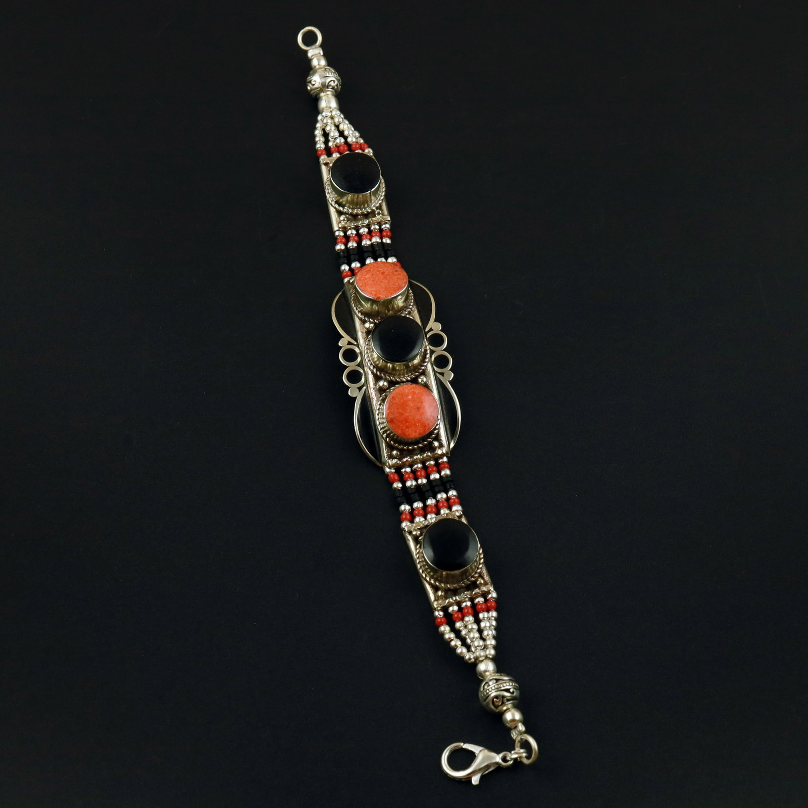 Tibetan Natural Black Onyx & Coral Handmade Boho Bracelet: Product ID: 260513133032 Product - Tibetan Handmade Ethnic Bracelet Gemstone - Natural Black Onyx & Coral Size - 7 Inch Weight - 50 Gram Approx Metal - Brass & Copper mix Metal Origin - Nepal Country/